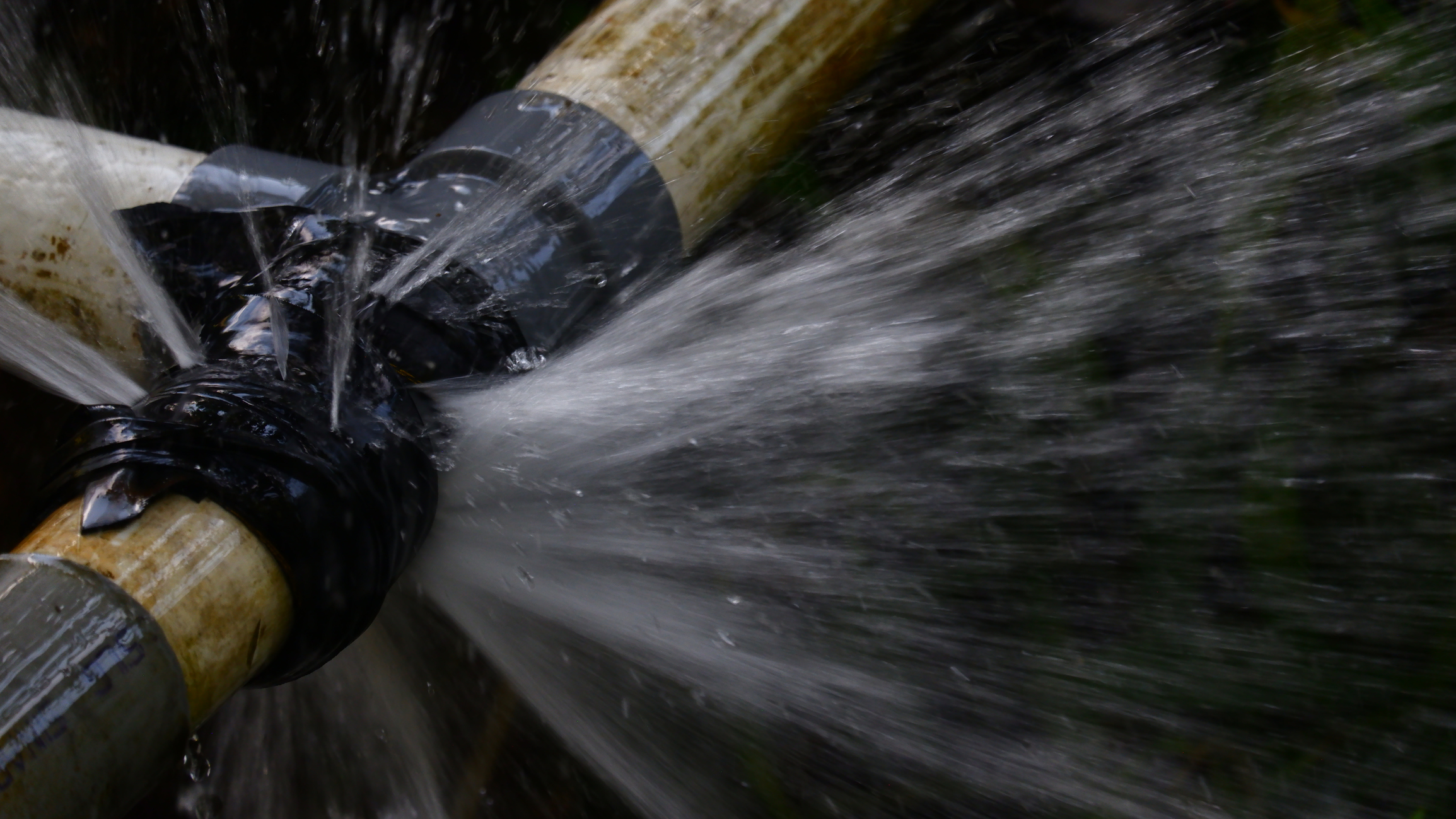 water-spray-coming-out-of-a-leaking-pipe